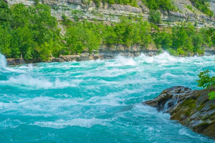 White water churning through the Whirlpool Rapids in the Niagara gorge.